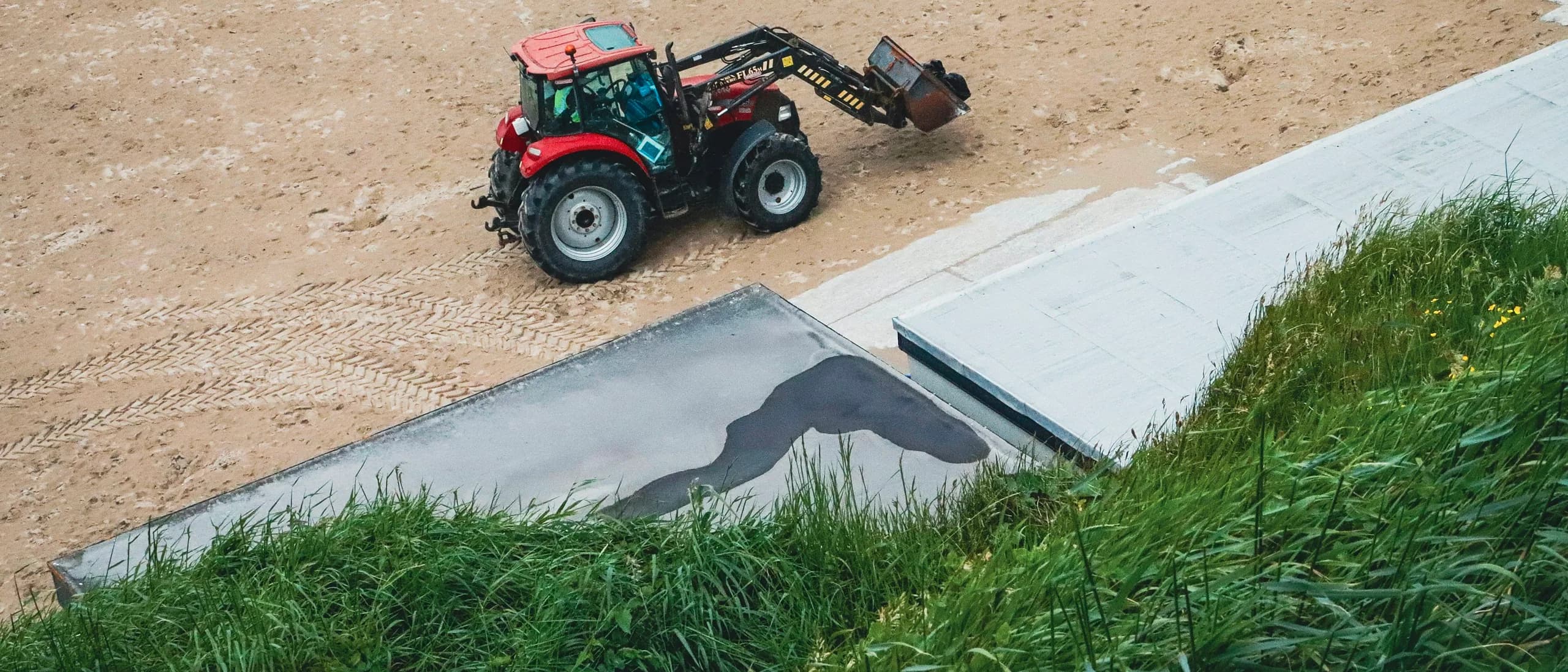 Compact Articulating Loader with Operator — tree care professionals at work