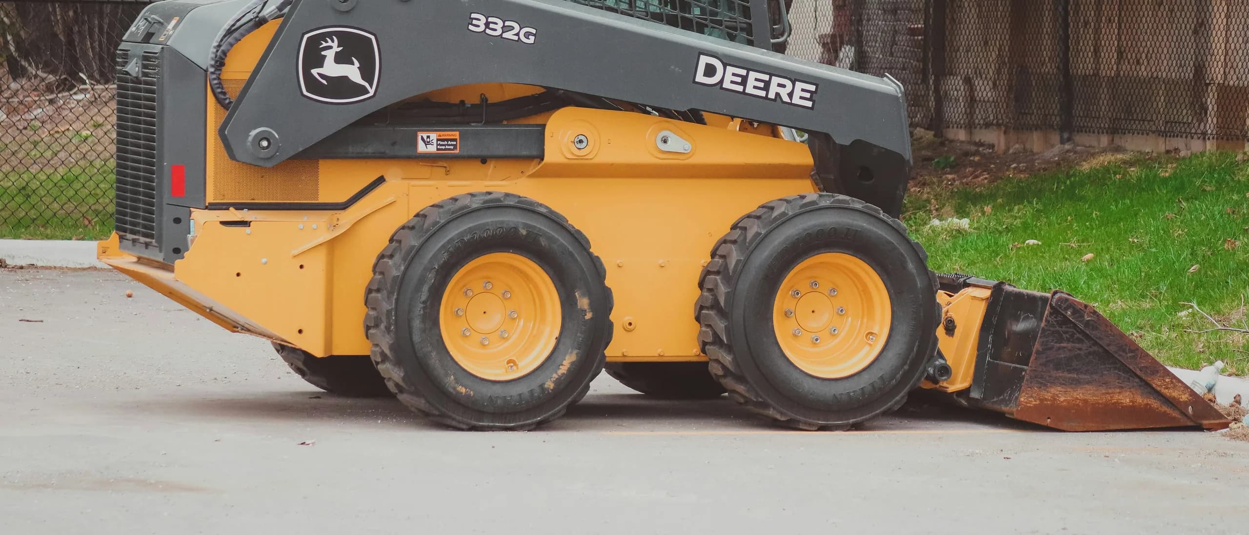 Mini Skid Steer with Operator — tree care professionals at work