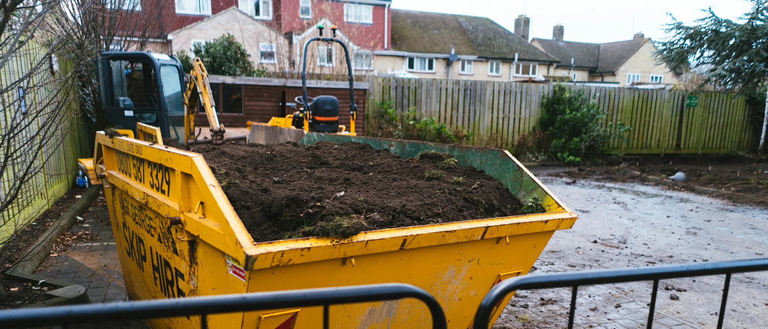 Roll-Off Dumpster / Container Service — tree care professionals at work
